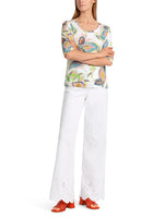 Marc Cain Pattern 3/4 Sleeve Top. A slim fit top with round neckline, 3/4 length sleeves and multicoloured floral motif.