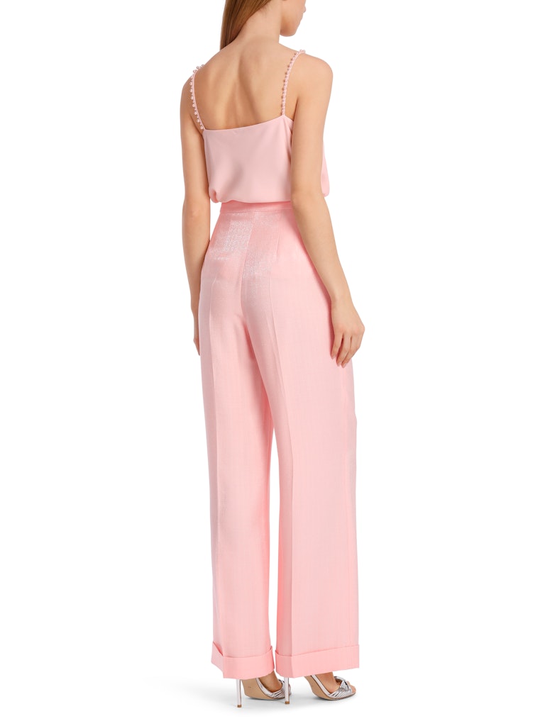 Marc Cain Wide Leg Wheaton Trousers. A wide leg, straight fit trouser with trimmed buttons, pockets and turn up hem. These trousers have a zip fastening and are a soft pink colour.