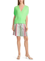 Marc Cain Short Sleeve Wrap Top. An oversized fit top with short sleeves and wrap design. The material is rib nit in a vibrant green colour.