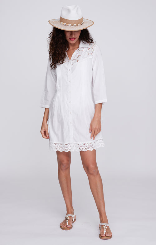Pia Rossini Ola Beach Shirt. A below-hip length shirt with 3/4 sleeves and collared V-neck. This shirt is white and has lace details.