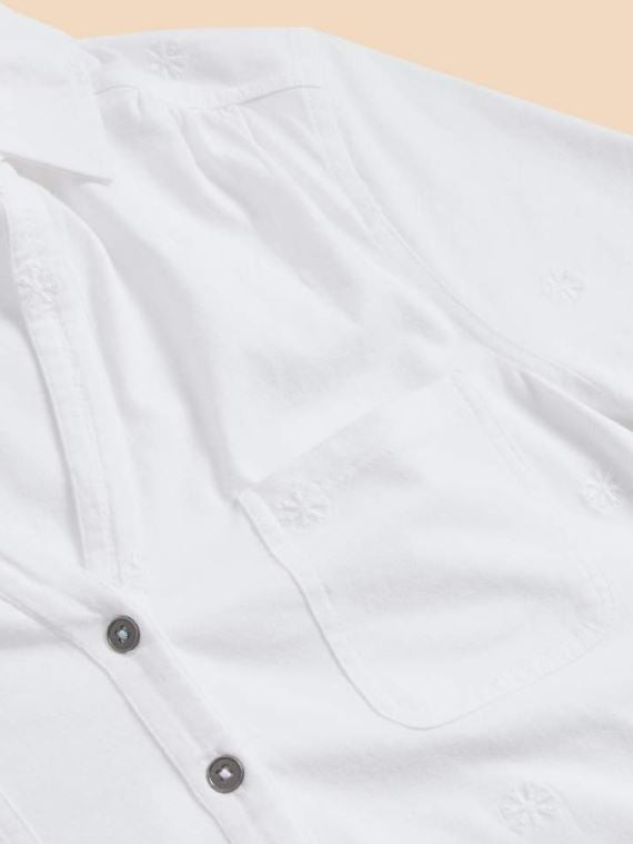 White Stuff Penny Pocket Embroidered Shirt. A short sleeved shirt with a V-neck, button fastening and two chest pockets. Subtle embroidery all-over