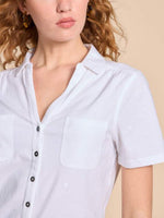 White Stuff Penny Pocket Embroidered Shirt. A short sleeved shirt with a V-neck, button fastening and two chest pockets. Subtle embroidery all-over