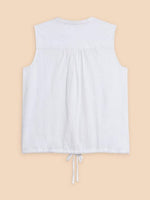 White Stuff Tulip Jersey Sleeveless Shirt. A button-up shirt with a tie hem and feminine intricate embroidery detail