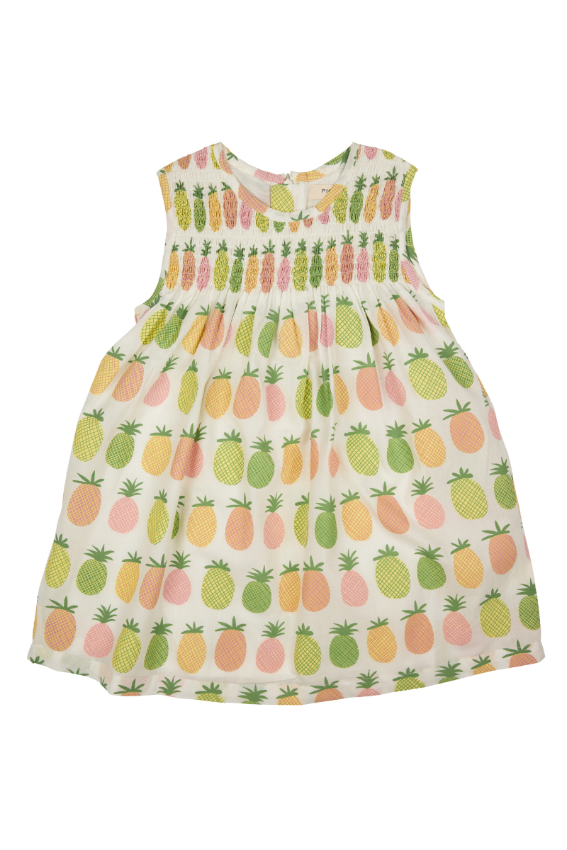 Pigeon Organics Sleeveless Smock Dress. A sleeveless kids dress with smocked detail and colourful pineapple print.