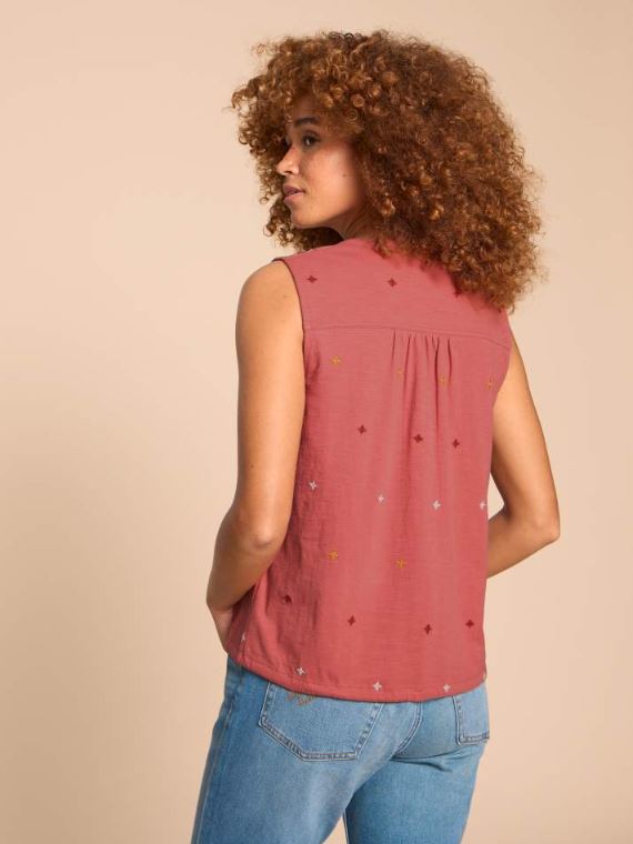 White Stuff Tulip Jersey Sleeveless Shirt. A button-up shirt with a tie hem and feminine intricate embroidery detail