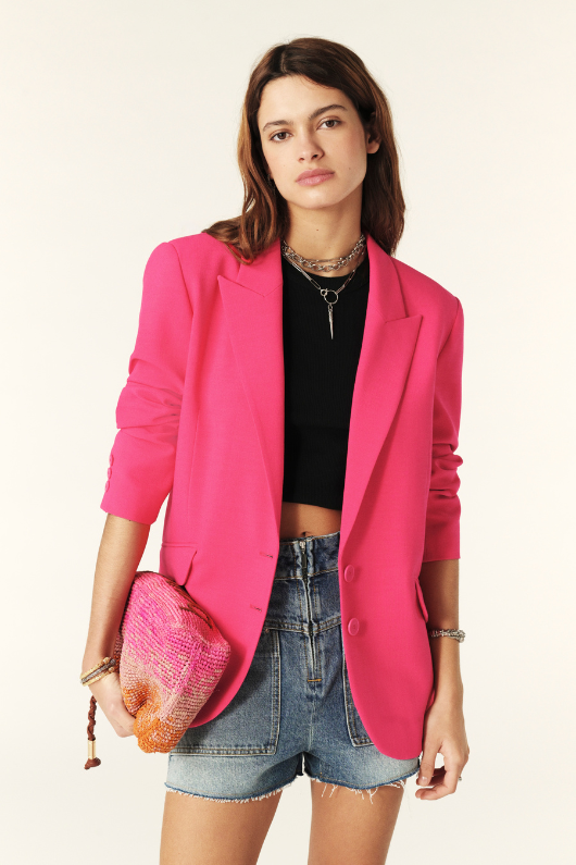 An image of a female model wearing the BA&SH Cher Oversized Blazer Jacket in the colour Pink.