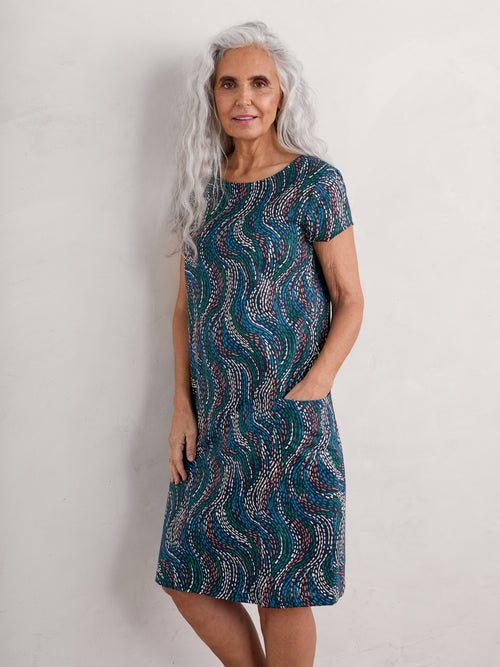 Seasalt River Cove Dress. An A-line dress with scoop neck, short sleeves, zip fastening, and multicoloured wavy print.