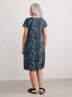 Seasalt River Cove Dress. An A-line dress with scoop neck, short sleeves, zip fastening, and multicoloured wavy print.