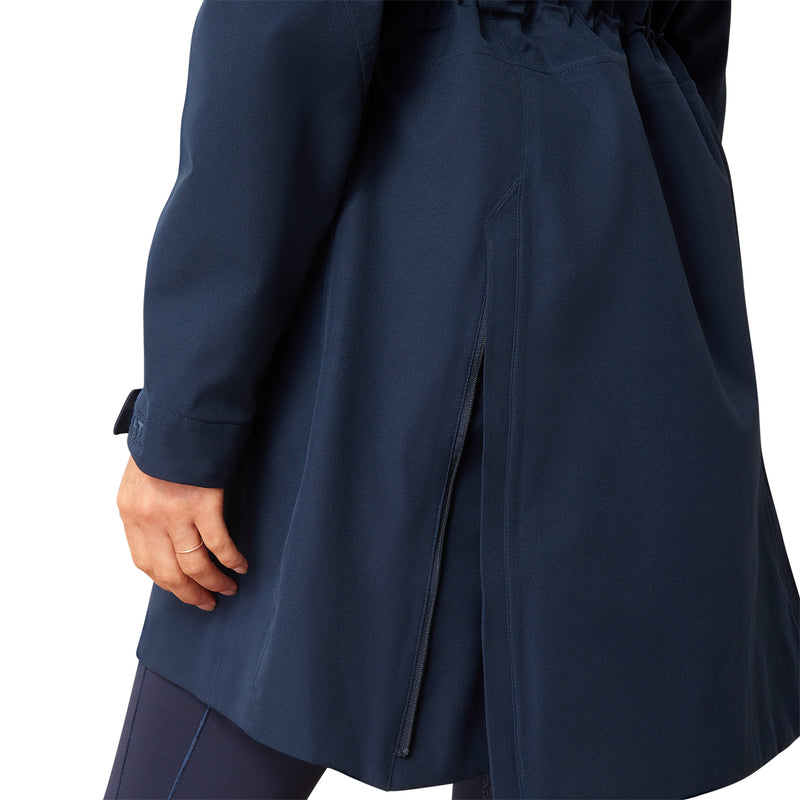 An image of a female model wearing the Ariat Coastal Long H20 Parka Jacket in the colour Navy Eclipse.