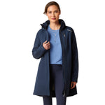 An image of a female model wearing the Ariat Coastal Long H20 Parka Jacket in the colour Navy Eclipse.