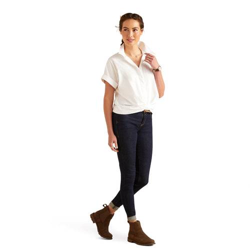 An image of a female model wearing the Brookside Shirt in the colour White.