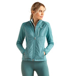 An image of a female model wearing the Ariat Fusion Insulated Jacket in the colour Brittany Blue.