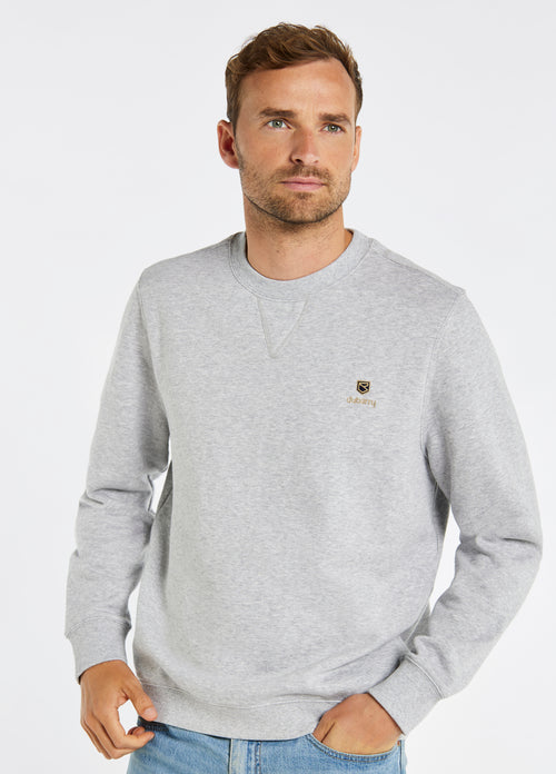 Dubarry Spencer Sweatshirt. A regular fit grey sweatshirt with long sleeves, crew neck and logo embroidery.