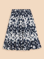 White Stuff Mayra Print Midi Skirt. A midi length tiered skirt with pockets, in a navy/white bold print.