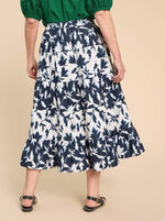 White Stuff Mayra Print Midi Skirt. A midi length tiered skirt with pockets, in a navy/white bold print.