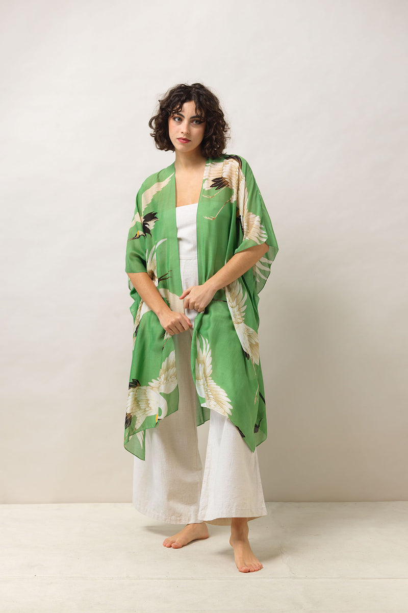 One Hundred Stars Throwover. A lightweight, shoulder cover up with an intricate green design.