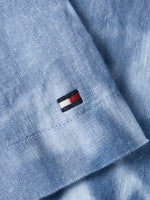 An image of the Tommy Hilfiger Palm Print Tie-Dye Linen Relaxed Short Sleeve Shirt in the colour Well Water.