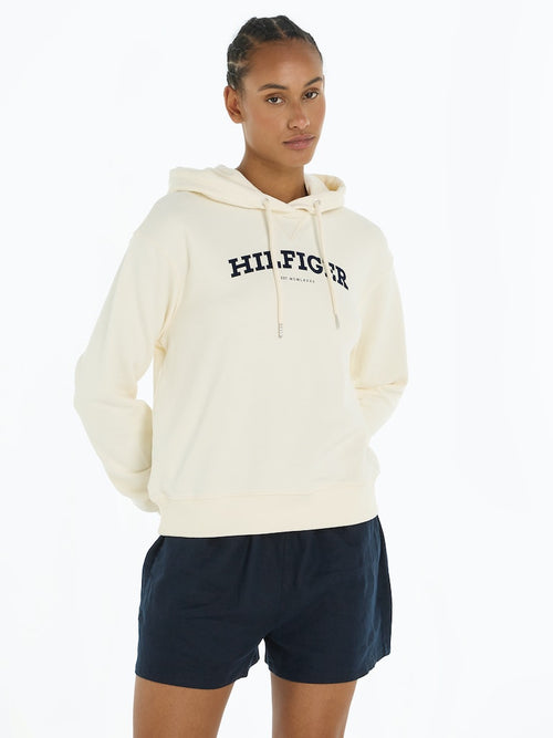 An image of the Tommy Hilfiger Flocked Hilfiger Monotype Logo Hoodie in the colour Calico.