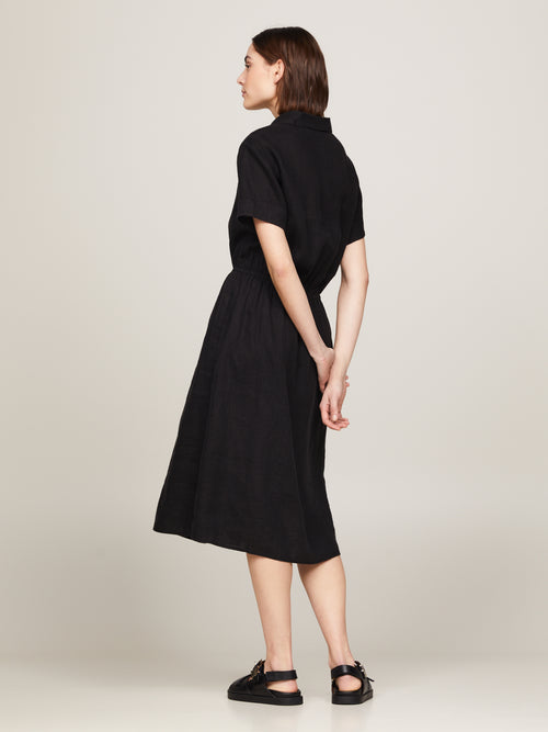 Tommy Hilfiger Midi Shirt Dress. A relaxed fit dress with short sleeves, collar, button fastenings, and logo embroidery. Black.