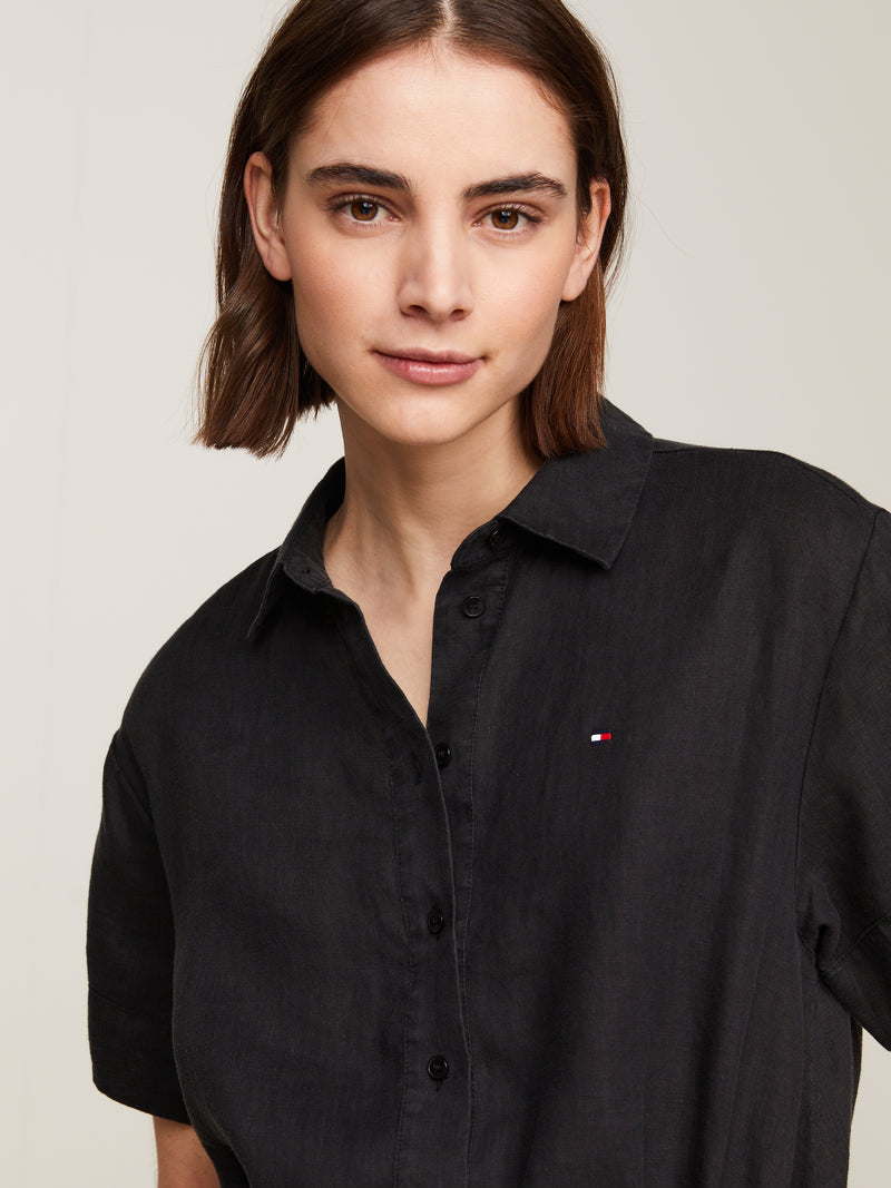 Tommy Hilfiger Midi Shirt Dress. A relaxed fit dress with short sleeves, collar, button fastenings, and logo embroidery. Black.