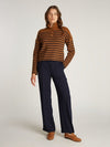 An image of the Tommy Hilfiger Gold Button Polo Sweater