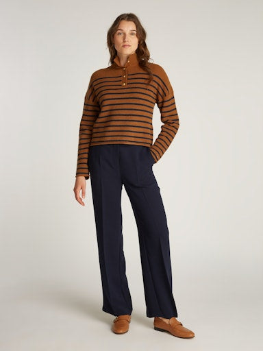 An image of the Tommy Hilfiger Gold Button Polo Sweater