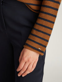 An image of the Tommy Hilfiger Gold Button Polo Sweater