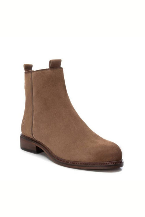 Carmela Suede Ankle Boot. A pair of leather boots in the colour taupe, which have a side zipper closure and small heel.