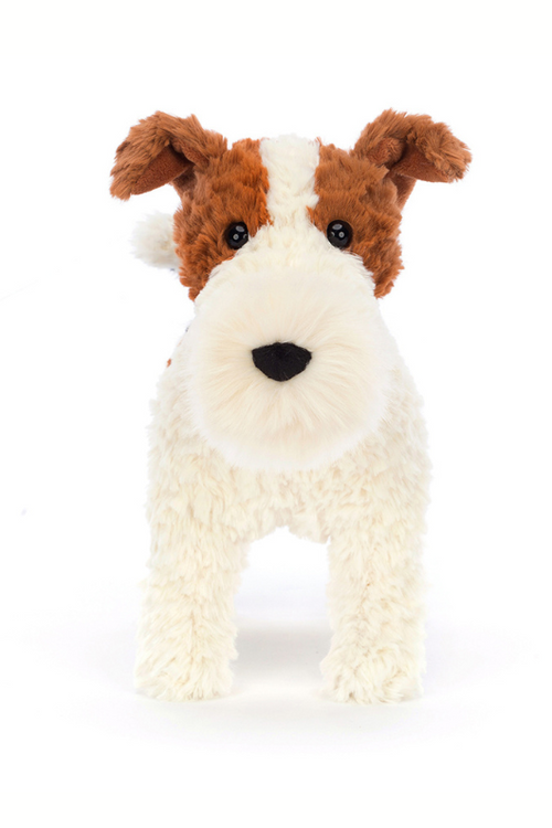Jellycat Hector Fox Terrier. A cuddly, scruffy soft toy dog with brown, black and white fur and a fluffy snout.