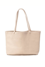 Carmela Handbag. A spacious beige leather shoulder bag with gold brand logo.