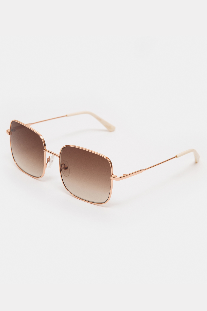 GLAS Wilma Sunglasses. A pair of rose gold sunglasses with square frames.