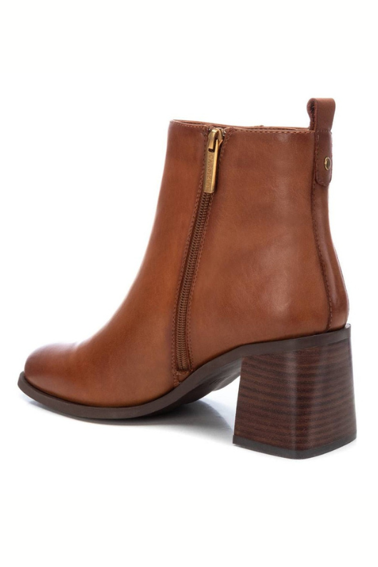 Carmela Leather Mid Heel Ankle Boot. A pair of camel coloured ankle boots with 7cm heel. These boots are made from leather, with side zip closure and non-slip sole.