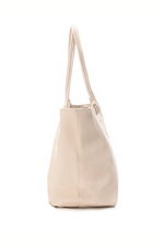 Carmela Handbag. A spacious beige leather shoulder bag with gold brand logo.