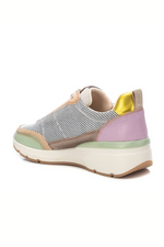 Carmela Trainer. A shiny, multicoloured leather trainer with non-slip sole.