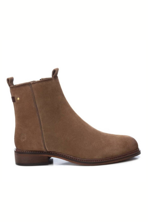 Carmela Suede Ankle Boot. A pair of leather boots in the colour taupe, which have a side zipper closure and small heel.