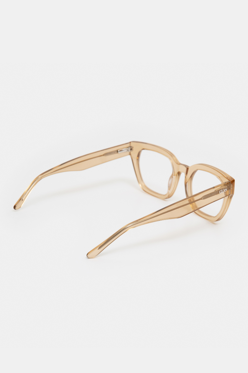 GLAS Kiara Readers. A pair of translucent caramel coloured reading glasses with a bold frame.