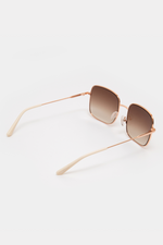 GLAS Wilma Sunglasses. A pair of rose gold sunglasses with square frames.