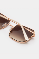 GLAS Wilma Sunglasses. A pair of rose gold sunglasses with square frames.