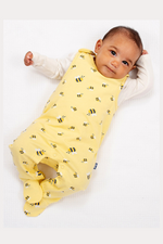 Kite Dungarees. A 2 piece set with cream bodysuit and yellow bumblebee print dungarees. The dungarees feature convenient popper closures.