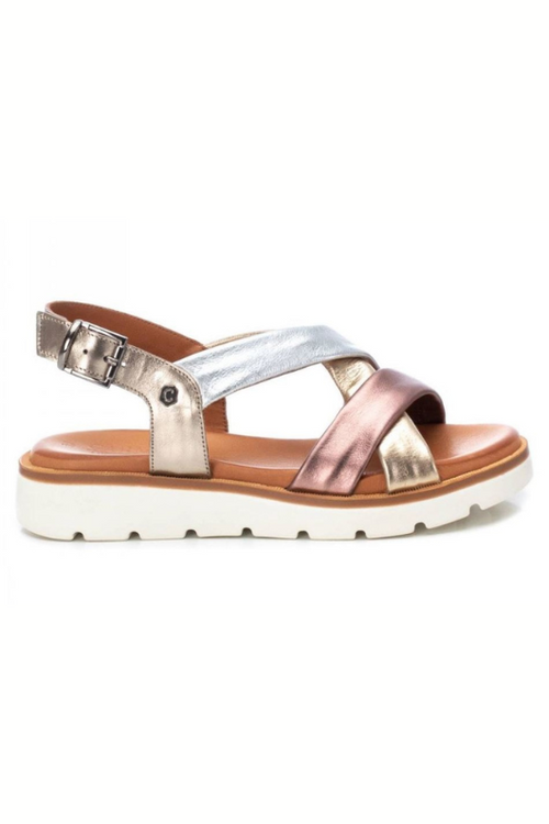 Carmela Flat Metallic Sandal. A pair of sandals with mixed colour metallic straps, buckle fastening and leather upper.