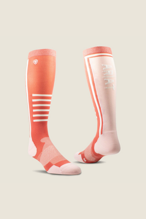 Ariat Slimline Performance Socks. A pair of long socks featuring moisture-wicking material, toe and foot cushioning, bone protection and mesh wrap. These socks are in the colour Faded Rose/Blush.