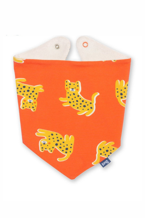 Kite Bib. A reversible bib with adjustable popper fastenings. The front has an orange leopard pattern and the reverse has cream towelling material.