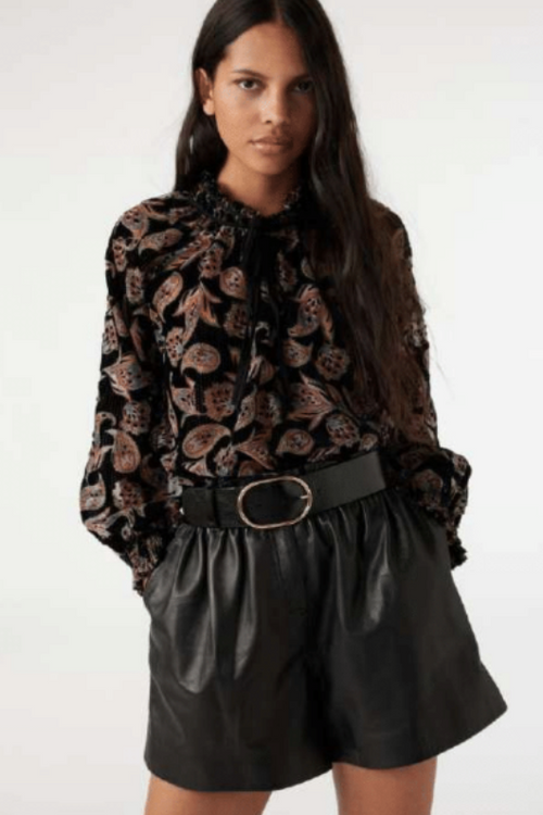 An image of a female model wearing the BA&SH Ruiz Gathered-Sleeve Blouse in the colour Black.