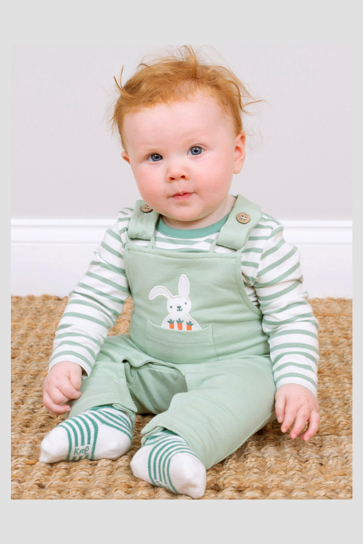 Kite Dungarees. A pair of green dungarees with bunny applique made from stretch fabric.