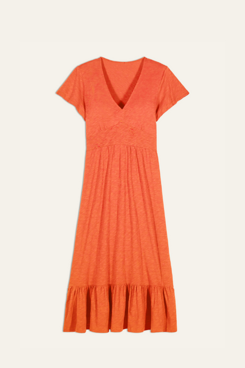 BA&SH Valma Dress. A midi length dress with short sleeves and V-neck. This dress features a ruffled skirt and smocked waist, and is in the colour orange.