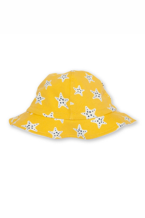 Kite Baby Hat. A reversible cotton hat featuring yellow starfish print, and spotty print on the inside.