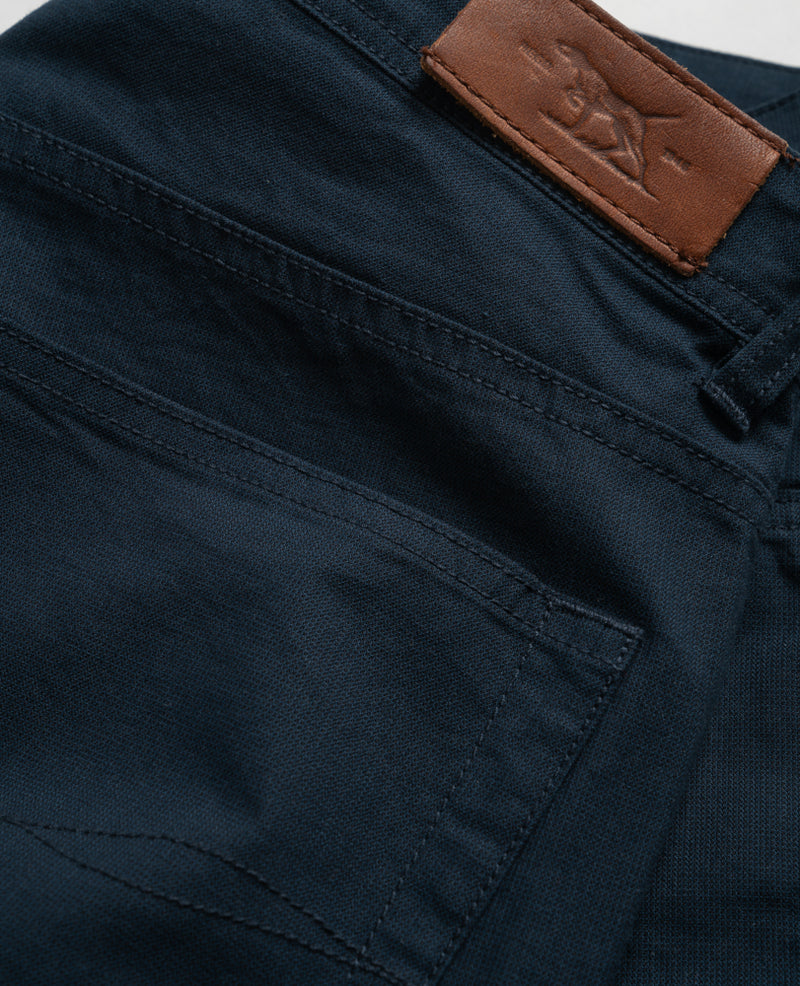 Gunn 5 Pocket Jeans by Rodd & Gunn. A straight fit trouser made with stretch fabric featuring pockets and navy hand washed appearance.