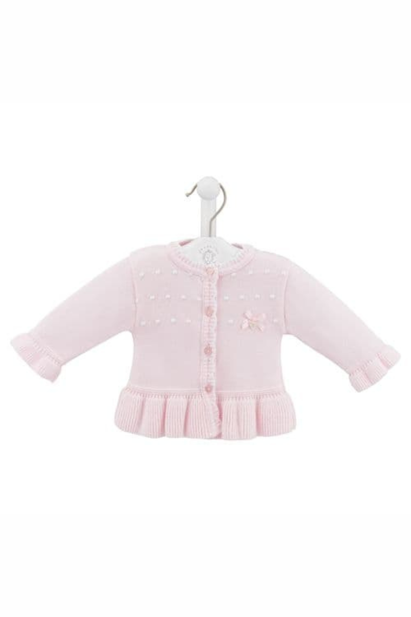 Dandelion Cotton Ruffle Cardigan. A long sleeve cardigan with ruffle hem, bow detail, and heart shaped buttons. This cardigan is made from a fine knit cotton in the colour pink.