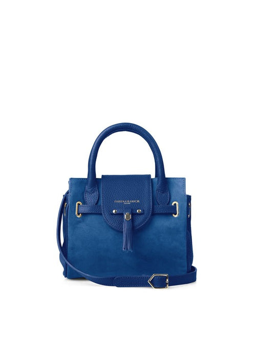 Fairfax & Favor The Mini Windsor. A mini windsor handbag with crossbody strap and tassel details. Suede and leather in the colour Porto Blue.