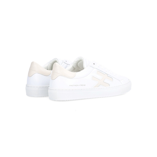 Alpe women's trainers in white with beige heel and detail on the side.